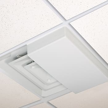 Close-up of a ceiling-mounted air vent with a white cover.