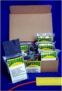 Boxes of Safcord insecticide and gel packets arranged neatly.